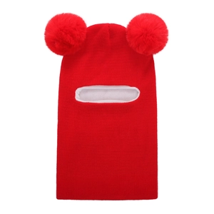 Detail of red knit baby balaclava with dual pom-poms and thick white fleece lining
