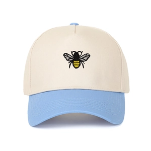 Two-tone baseball cap with bee embroidery and cream crown with light blue brim