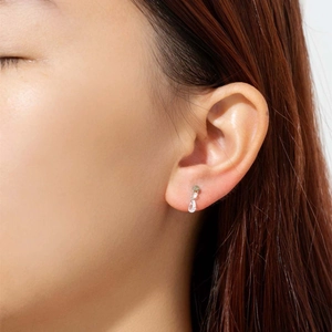 Elegant S925 sterling silver pear-shaped zircon stud earrings shown on model