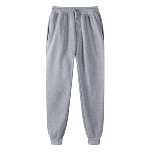 Detail view of gray thermal sweatpants featuring adjustable drawstring waist and ribbed cuffs