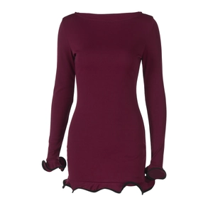 Detail of ruffle hem and sleeves with black trim on a fuchsia long sleeve knit dress