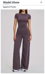 Detail view of eggplant purple athletic set featuring short sleeve T-shirt and wide leg pants