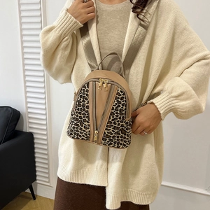 Chic leopard print khaki leather backpack with gold zippers for women's casual style