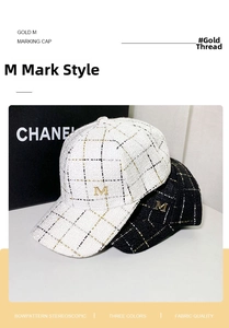 Detail of tweed check baseball cap with golden M logo and metallic gold thread weaving