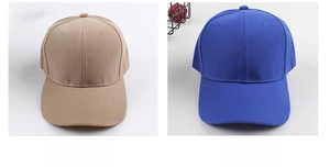 Detail view of khaki and blue cotton twill baseball caps with six-panel structure