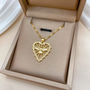 Golden heart necklace with crystal dove pendant inside elegant jewelry box display
