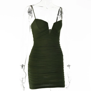 Close-up of dark green bodycon dress with ruching detail and V-neckline on mannequin