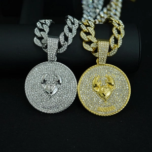 Detailed close-up of Scorpio zodiac pendant with micro-pave crystals on heavy Cuban chain