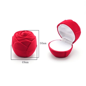 Macro view showing rose-shaped velvet ring box dimensions of 49mm by 50mm