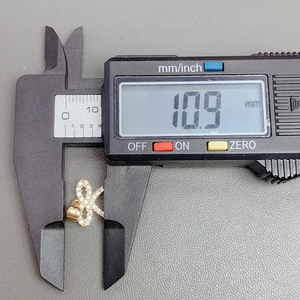 Detailed measurement of 10.9mm butterfly crystal zircon pendant with digital calipers