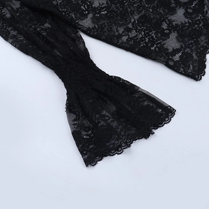 Close-up of black lace long sleeve with elegant flared cuffs and detailed floral patterns