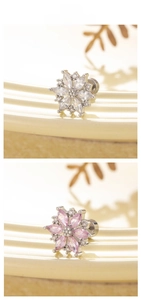 Detailed view of flower zircon cartilage studs with surgical steel screw flat backs