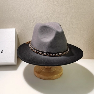 Detail of grey-black gradient wool felt jazz hat with diamond-studded woven band