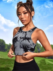 Detail of seamless tie-dye sports crop top with ribbed texture and racerback design