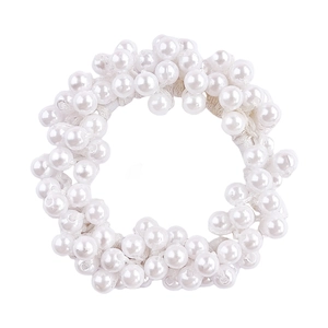 Close-up of a white elastic hair scrunchie made of lustrous imitation pearls on white background