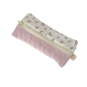 Floral fabric pencil case with pink quilted pattern and smooth zipper closure