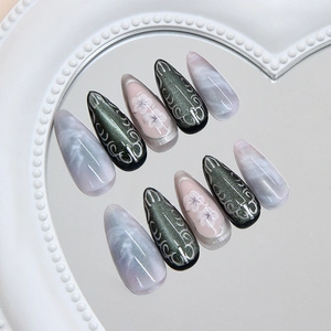 Press on nails with olive green cat eye effect, silver accents and marble floral designs