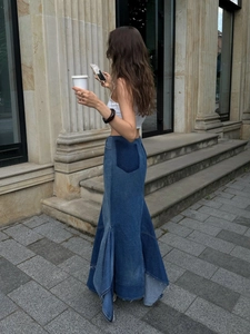 Patchwork denim maxi skirt featuring irregular hem and high waist design in blue tones