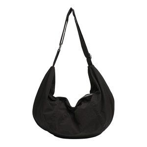 Japanese style black nylon dumpling crossbody bag with adjustable strap and large capacity