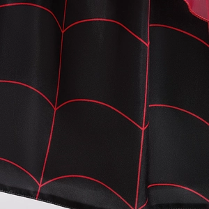 Macro detail of glossy black polyester fabric featuring a vibrant red spider web pattern