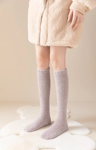 Detail showing the plush purple coral fleece texture of these warm knee-high socks