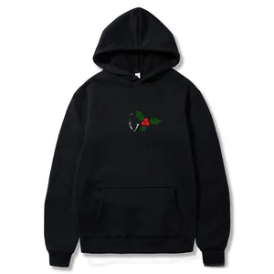 Close-up of black Christmas hoodie featuring Merry Christmas print and kangaroo pocket