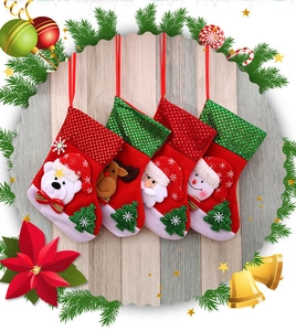 Set of 4 Christmas stockings featuring Santa, reindeer, snowman, and polar bear characters
