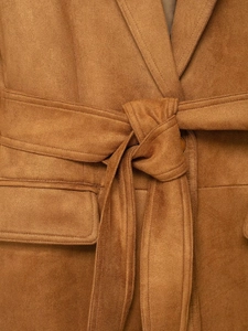 Close-up of brown faux suede blazer featuring notched lapels and decorative waist tie detail