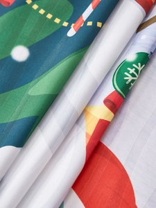 Detailed close-up of smooth Christmas curtain fabric with snowman and candy cane prints