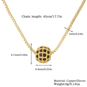 Macro shot of gold-plated hollow sphere pendant with black zircon inlays and dimensions