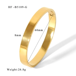 Detail view of 8mm gold mirror-polished stainless steel bangle with side hinge clasp