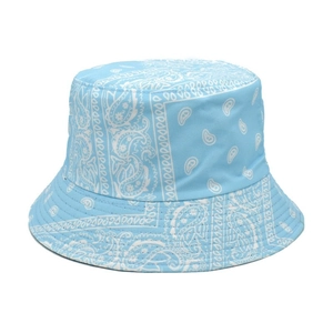 Detail of light blue paisley bucket hat showing precise white floral print patterns