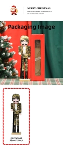 Close-up of 38cm wooden nutcracker in camouflage uniform and red window display box