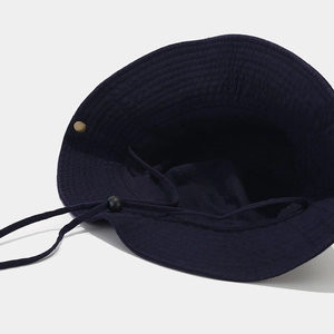 Navy blue cotton bucket hat with adjustable windproof drawstring and metal rivet detail