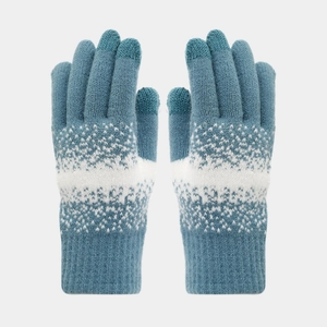 Close-up of blue and white snowflake knit gloves with touch screen fingertips