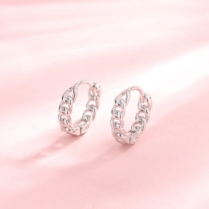 Polished S925 sterling silver chain link hoop earrings on a soft pink gradient background