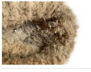 Close-up of the dense khaki faux fur lining showing warm plush texture and soft material