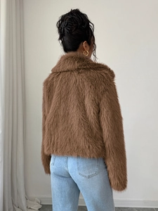 Back view of elegant brown faux fur coat showing soft plush texture and premium quality