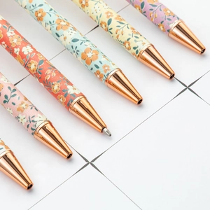 Creative floral pattern ballpoint pens with rose gold metal clips in a 7-piece set