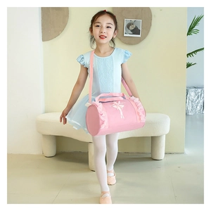Detail of pink ballet dance bag featuring lace trim and ballerina silhouette print
