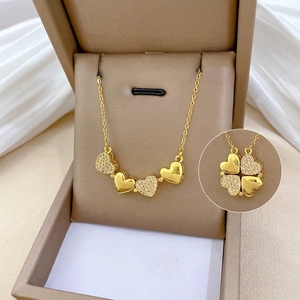 Gold titanium steel necklace with diamond hearts that transform into a four-leaf clover