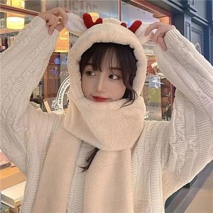Detail of Christmas reindeer fleece hooded scarf with cute red antlers and plush ears