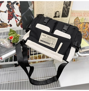Detailed view of canvas messenger bag with buckle closure on retro aesthetic background