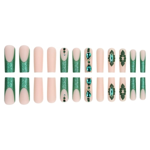 Emerald green press-on nails with glitter French tips and gemstone rhinestone accents