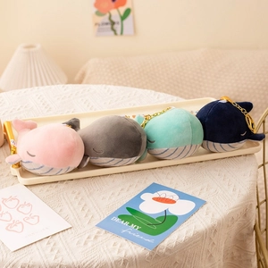 Cute whale plush keychains in four colors with soft fabric and golden metal rings
