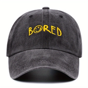 Vintage washed dark gray baseball cap featuring yellow BORED embroidery with a smiley face