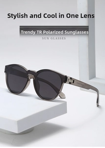 Close-up of translucent grey TR sunglasses with polarized lenses and metal hinges