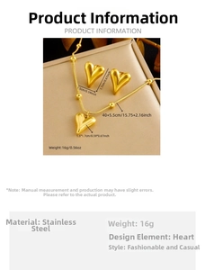 Detail view of heart-shaped stainless steel necklace and earrings set in golden finish