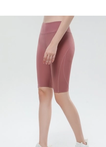 Detail of high-waisted yoga shorts in dusty rose with ergonomic side stitching