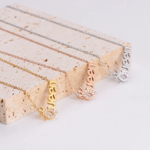 Elegant Queen pendant necklaces in gold, silver, and rose gold with diamond crown accents
